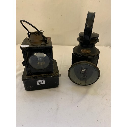 159 - Two vintage railway lamps one labelled Veritas Labels London