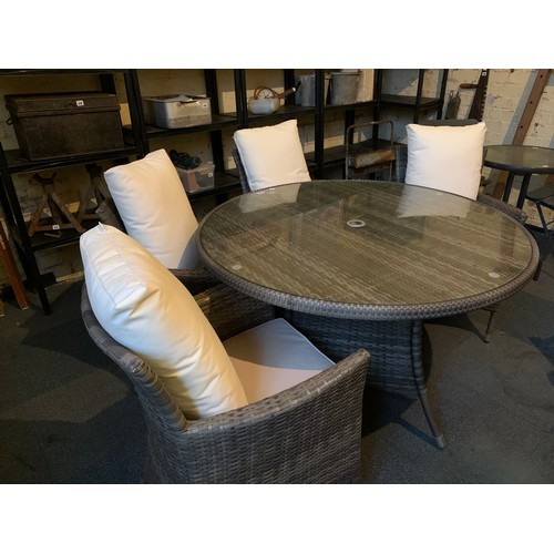 397 - Modern faux rattan garden suite comprising of a  circular table and 4 armchairs with showerproof cus... 