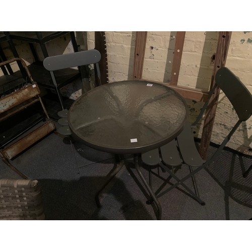 396 - Modern metal 3 piece garden suite comprising a pair of folding chairs and glass top circular table