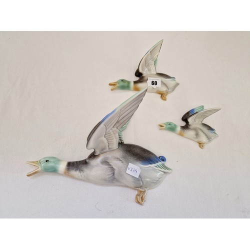 60 - Poole Pottery - a set of three wall mounted, graduated flying mallards