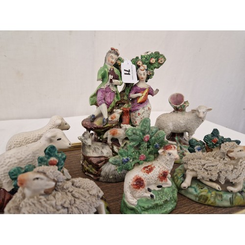 71 - Seven various Staffordshire sheep figurines and spill vases