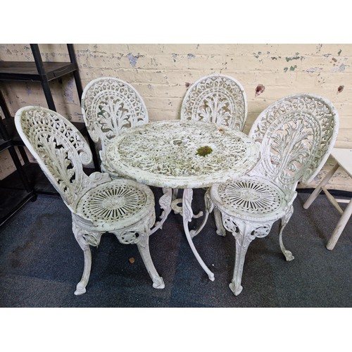 279 - Pierced metal garden set comprising circular garden table and 4 chairs