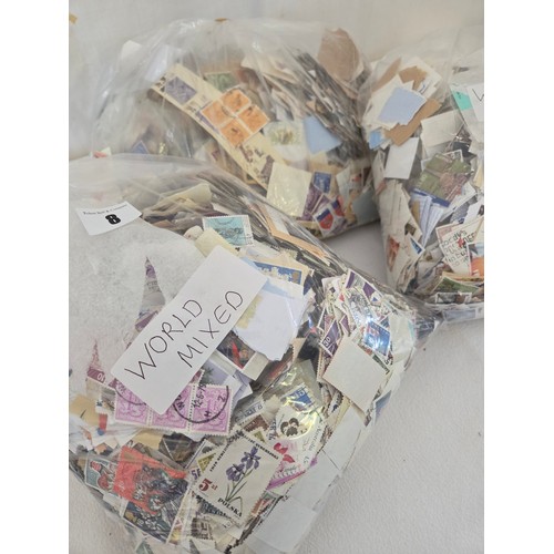 8 - Three bags of cut used mixed World stamps