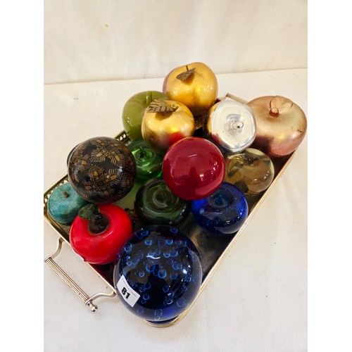 81 - Tray of coloured glass, ceramic and other weights, dumps and apples