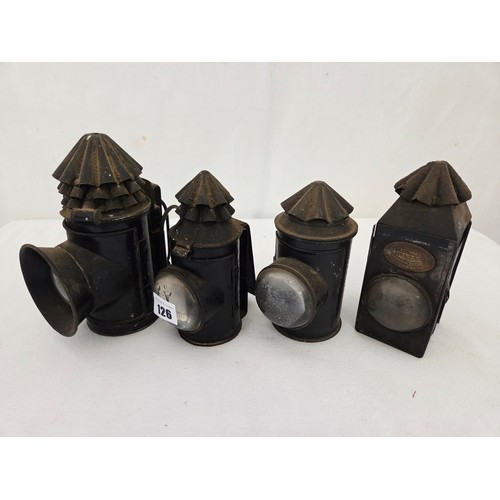 126 - Four vintage police handheld carbide lamps incl. Hetherington & Co