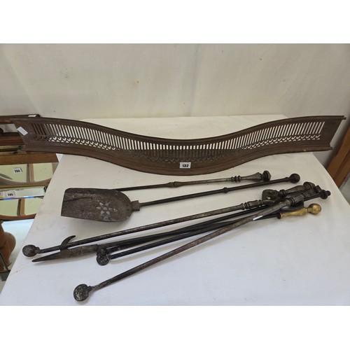 132 - Edwardian pierced steel fender and companion set