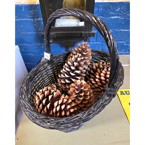 156 - Painted wicker basket containing giant pinecones