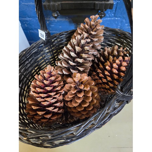 156 - Painted wicker basket containing giant pinecones