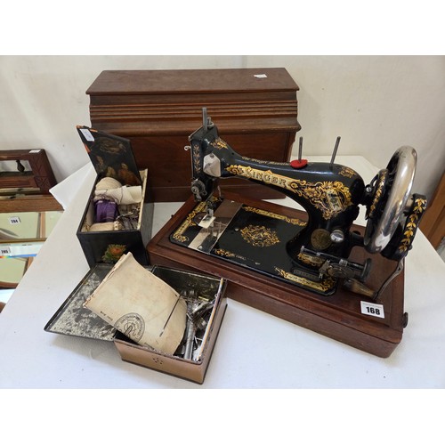 168 - Vintage cased Singer sewing machine and 2 tins of accessories