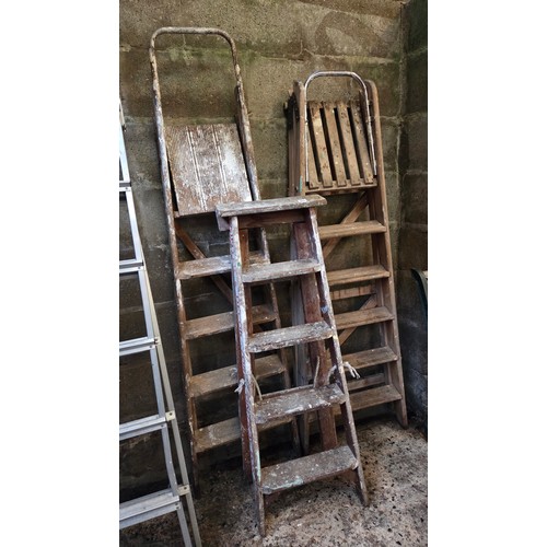 Three sets of vintage wooden step ladders