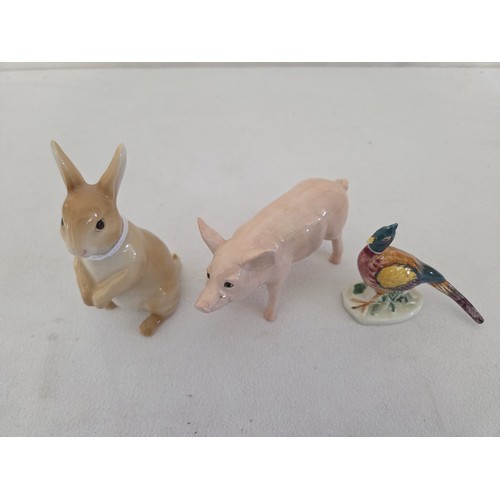 63 - Three Beswick gloss animal figurines, standing rabbit, white pig and cock pheasant