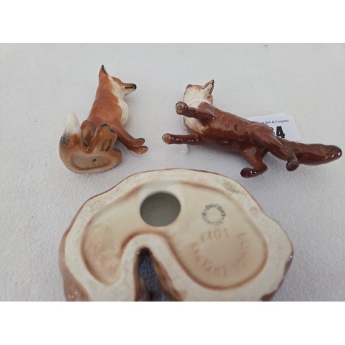 64 - Three Beswick gloss fox figurines