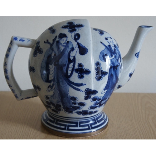 175 - A Chinese blue and white Cadogan teapot painted with four standing Chinese male figures, the handle ... 