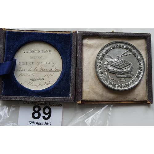 89 - A Guernsey Reward of Merit medal with paper label inscribed 'Valnord Bank School Prize Medal Peter D... 