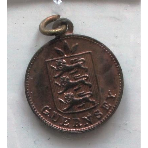 92 - A Guernsey Red Cross copper medal dated 1915, one side with a red enamel cross.