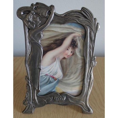 311 - A WMF style pewter photo frame with easel back and inset watercolour, 'Classical maiden'.