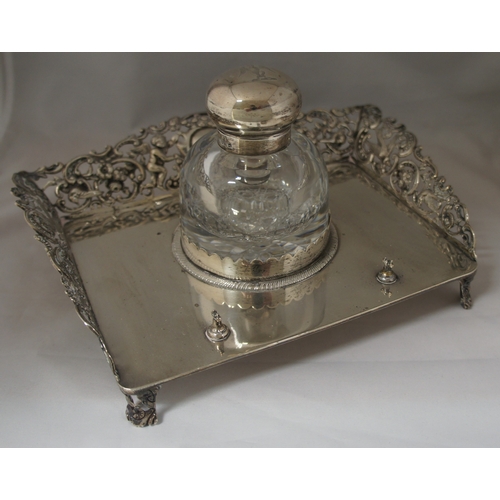 3 - A late Victorian silver ink stand by William Comyns, of rectangular form with three quarter pierced ... 