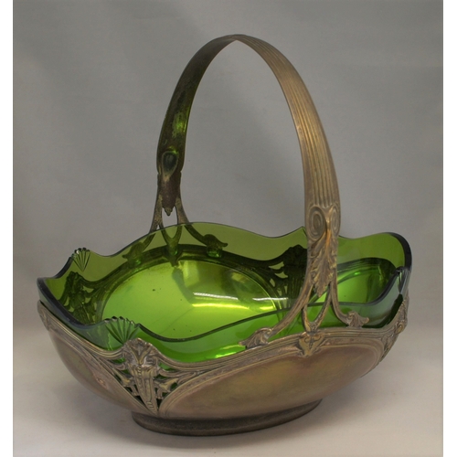 7 - An art nouveau pewter and glass fruit basket, early 20th century, with fixed reeded handle, the bask... 