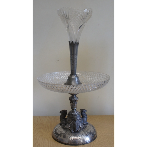 8 - A silver plated and cut glass table centre with epergne, late 19th century, the cast base decorated ... 