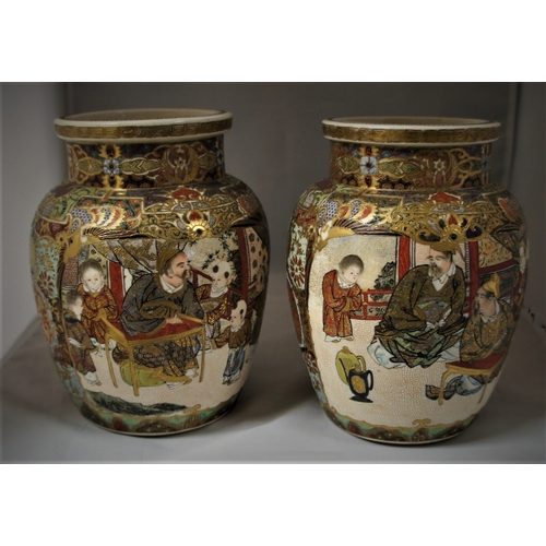 16 - A pair  of Satsuma vases, of squat baluster form with typical extensive decoration, 18 cm. high.