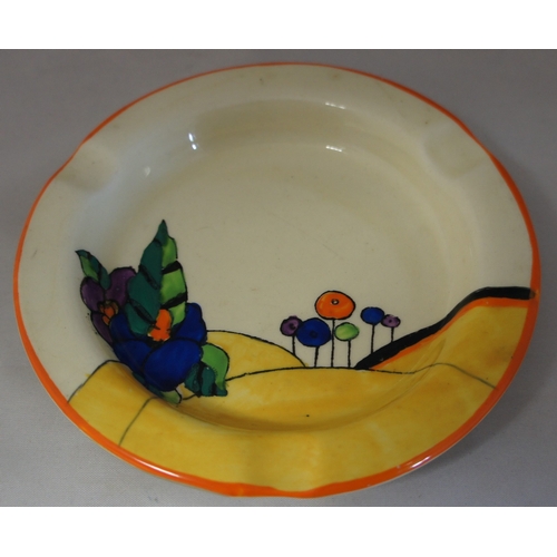 35 - A Clarice Cliff ashtray, Woodland design (a./f.), 12.5 cm. diameter.