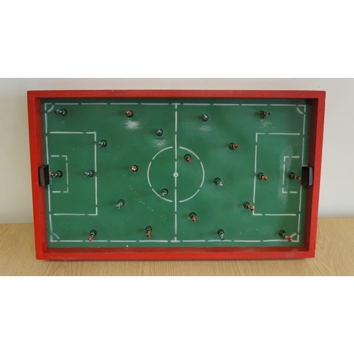 63 - A Polish table football game, with coloured and illustrated lidded box, 58.5 x 33.5 cm.