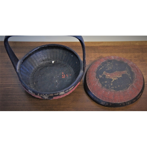 76 - A gilt decorated provincial Oriental wicker food basket with lid, painted with floral and bird decor... 