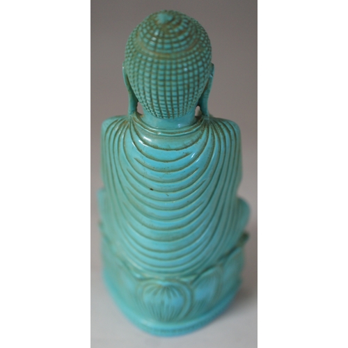 77 - A carved Buddah figure, 10 cm. high.