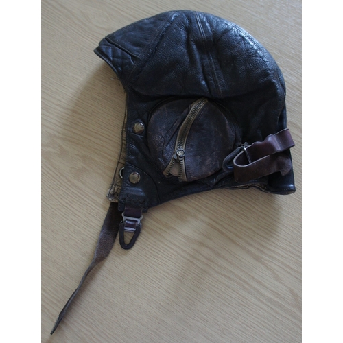 96 - A WW II R.A.F. brown leather flying helmet, the interior with cloth trade label for Frank Bryan Limi... 
