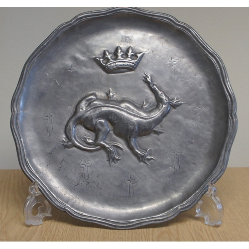 21 - Set of four pewter wall plaques, with animal and other armorial centres.