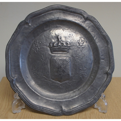 21 - Set of four pewter wall plaques, with animal and other armorial centres.