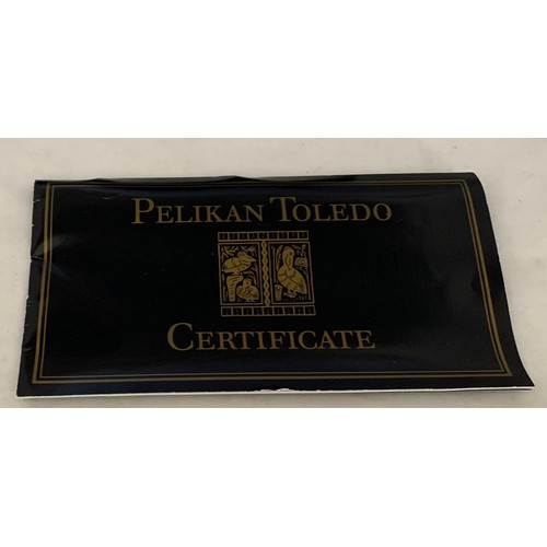 63 - A Pelikan Toledo M900 fountain pen, with 18 ct gold nib, case and certificate.