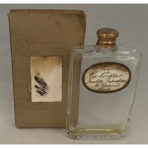 103 - Sark Eau de Cologne bottle, with gilt metal screw lid and paper label inscribed 'Eau de Cologne Qual... 