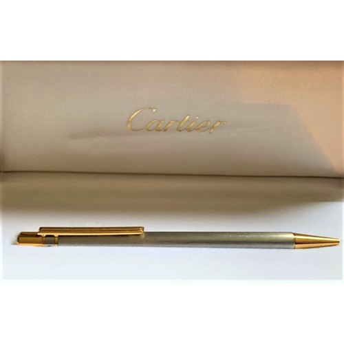 100 - A boxed and unused Cartier Stylo Must De Cartier ballpoint pen.