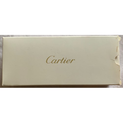 100 - A boxed and unused Cartier Stylo Must De Cartier ballpoint pen.