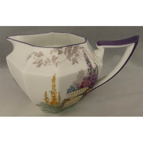 108 - Shelley 'Garden Urn' milk jug with hand painted decoration and purple trim, Registered design 723406... 