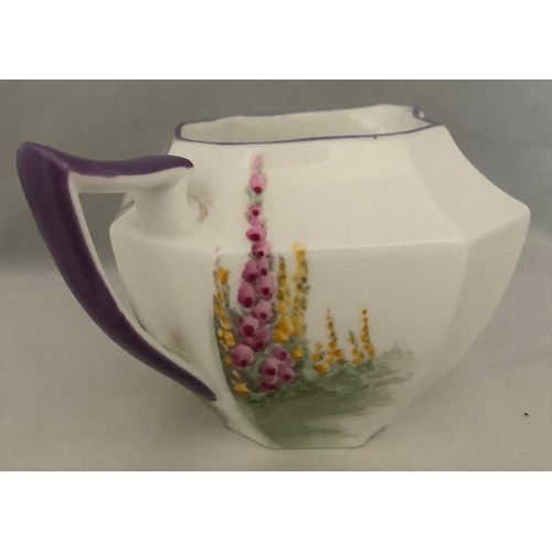 108 - Shelley 'Garden Urn' milk jug with hand painted decoration and purple trim, Registered design 723406... 