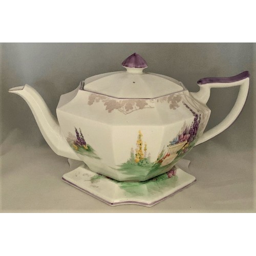 109 - Shelley 'Garden Urn' design octagonal shaped teapot on matching stand, with hand painted decoration ... 