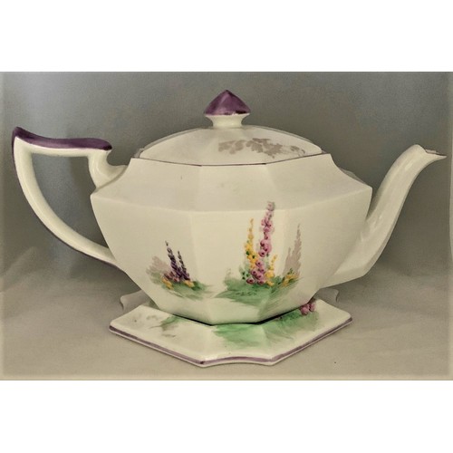 109 - Shelley 'Garden Urn' design octagonal shaped teapot on matching stand, with hand painted decoration ... 