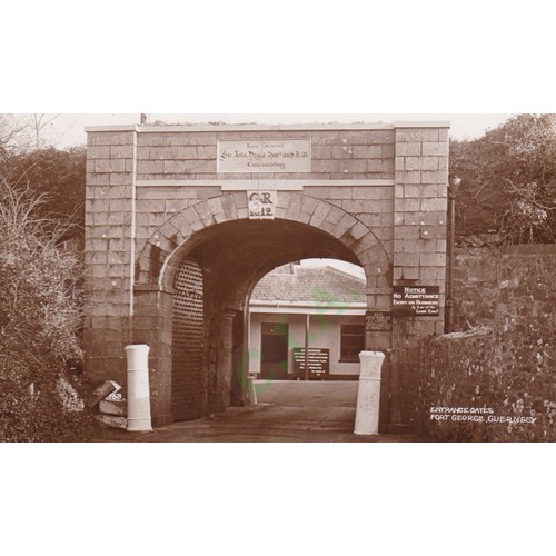 184 - Real Photographic postcard by Norman Grut, entrance gates to Fort George, Guernsey, circa 1920.