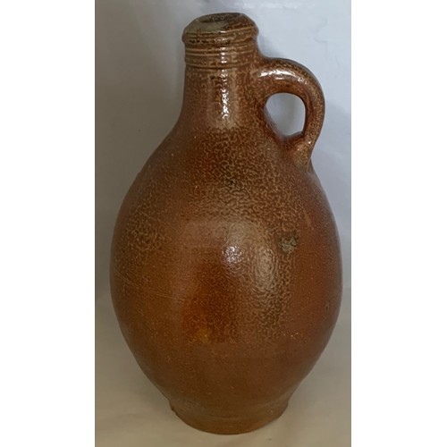 9 - Salt glazed wine flagon, Continental 18th century, with ring handle, 29 cm high.