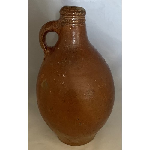 9 - Salt glazed wine flagon, Continental 18th century, with ring handle, 29 cm high.