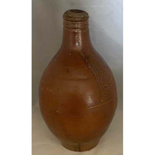 9 - Salt glazed wine flagon, Continental 18th century, with ring handle, 29 cm high.