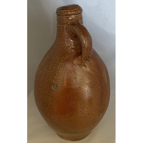 9 - Salt glazed wine flagon, Continental 18th century, with ring handle, 29 cm high.