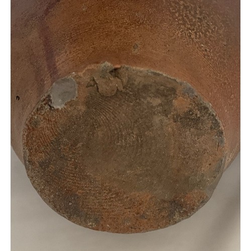 9 - Salt glazed wine flagon, Continental 18th century, with ring handle, 29 cm high.