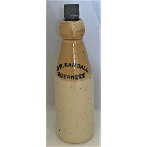 7 - Stoneware two tone bottle, with black transfer, R.W Randall Guernsey, with screw stopper, crisp impr... 