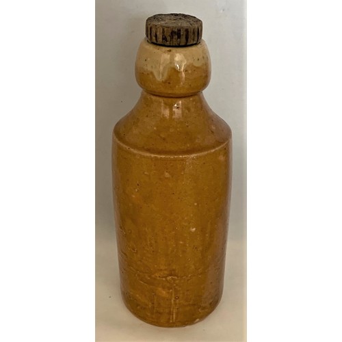 22 - Stoneware bottle, honey colour glaze, with black transfer, W.J.Palmer and Son Guernsey Olde Fashione... 