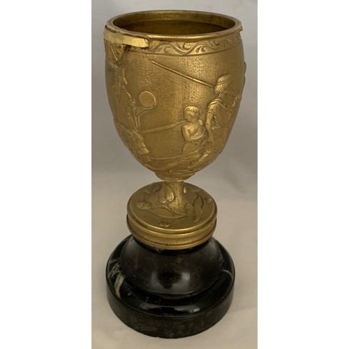 33 - A gilt brass Romanesque urn, 19th century, decorated with seven figures and a lion in high relief, s... 