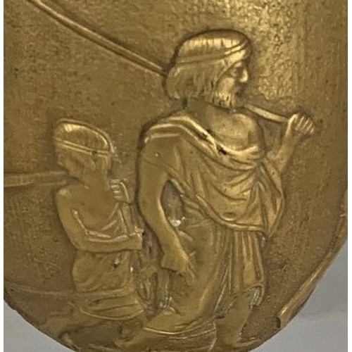 33 - A gilt brass Romanesque urn, 19th century, decorated with seven figures and a lion in high relief, s... 