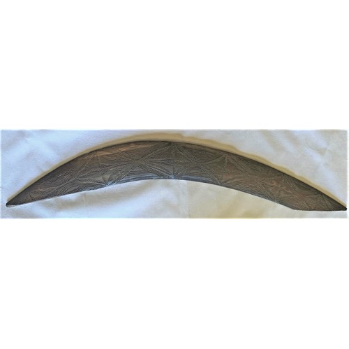 35 - Vintage Australian Boomerang with carved decoration, one tip missing (a/f), 54 cm wide.